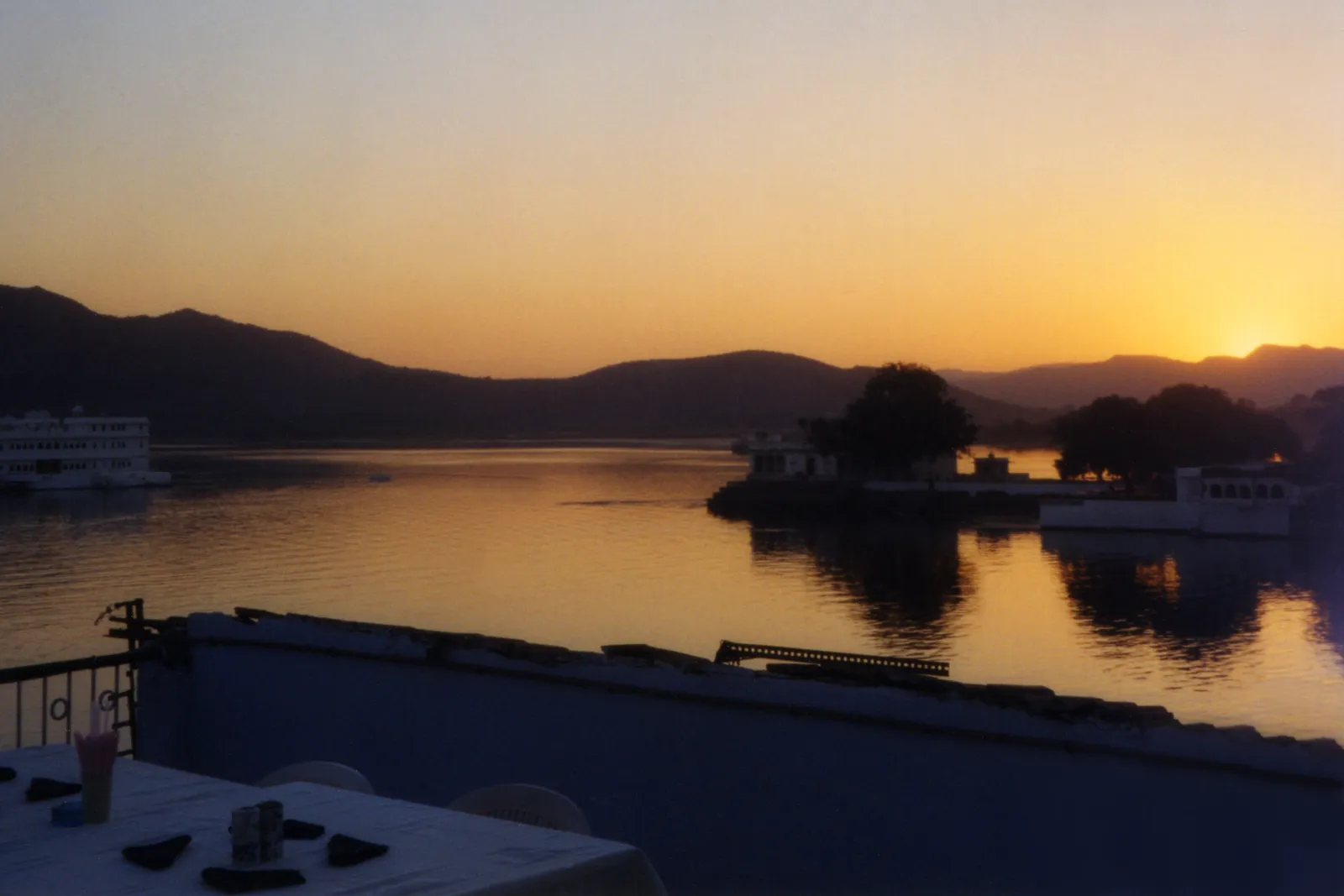 Dusk over Lake Pichola, seen from a terrace table